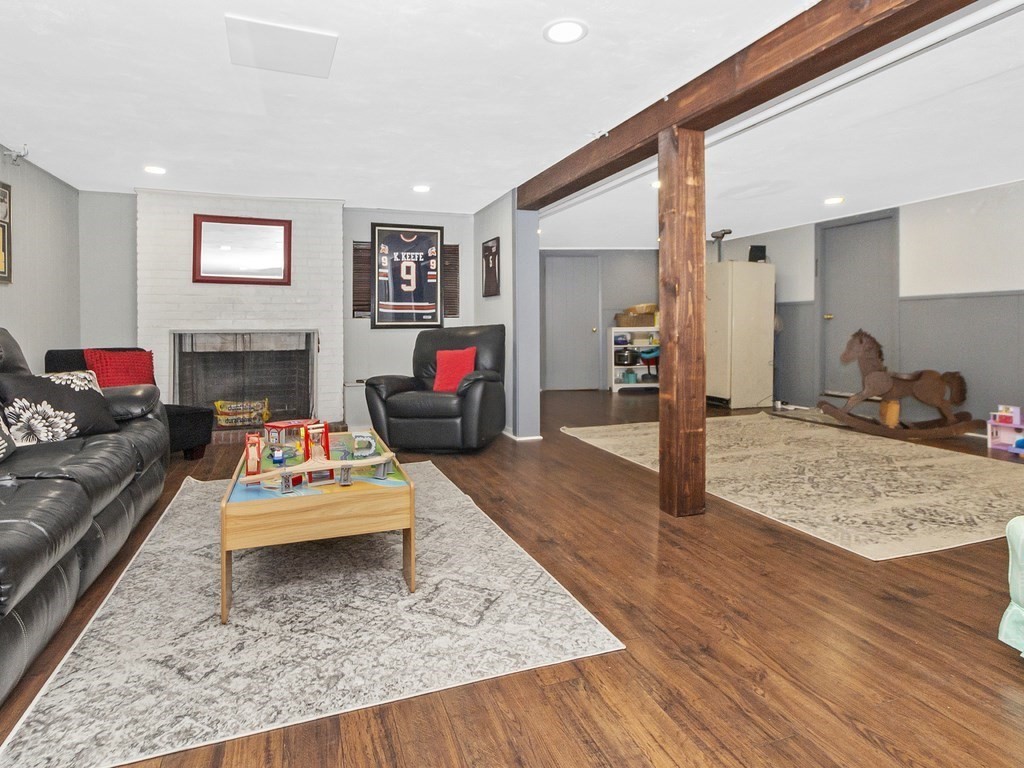 237 Linden Street Waltham, MA 02452 - Photo 25 of 33 a living room with furniture and a wooden floor