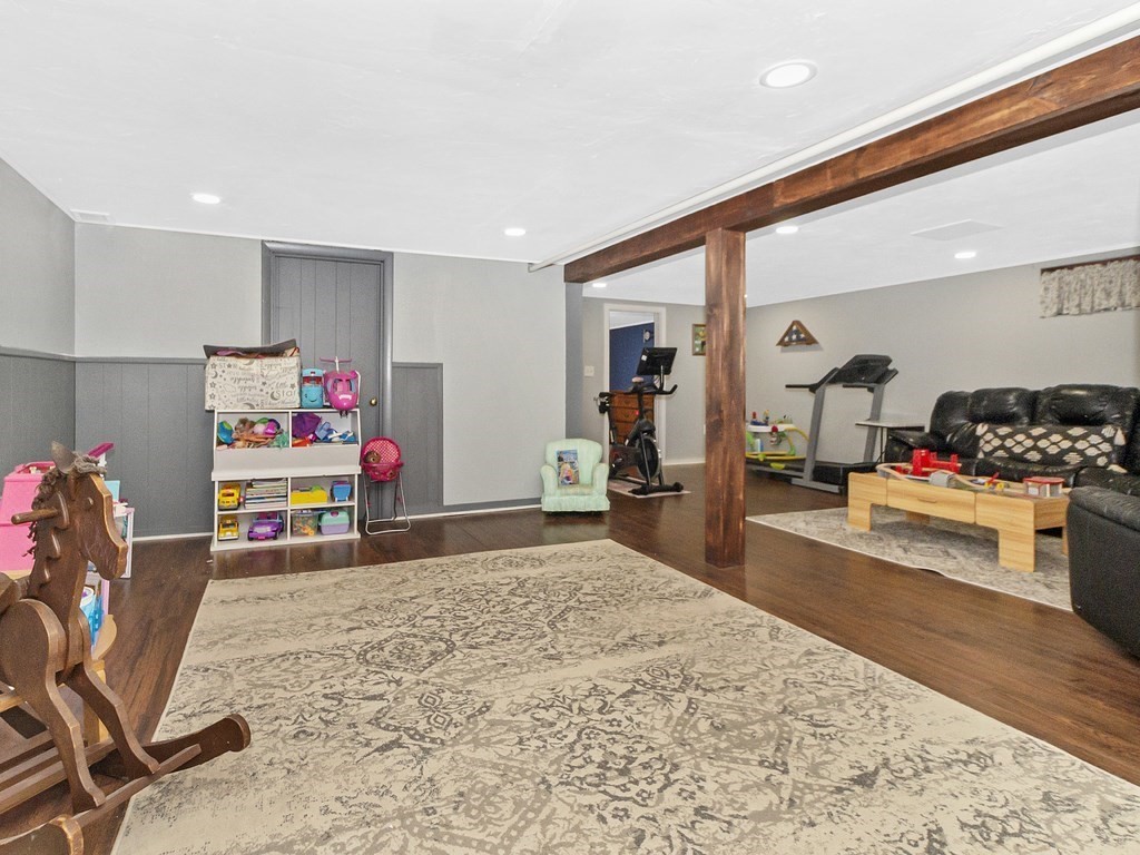 237 Linden Street Waltham, MA 02452 - Photo 26 of 33 a bedroom with furniture and a bed