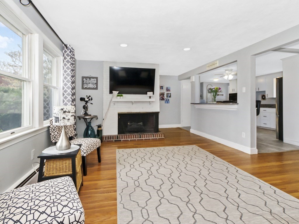 237 Linden Street Waltham, MA 02452 - Photo 7 of 33 a living room with furniture fireplace and flat screen tv