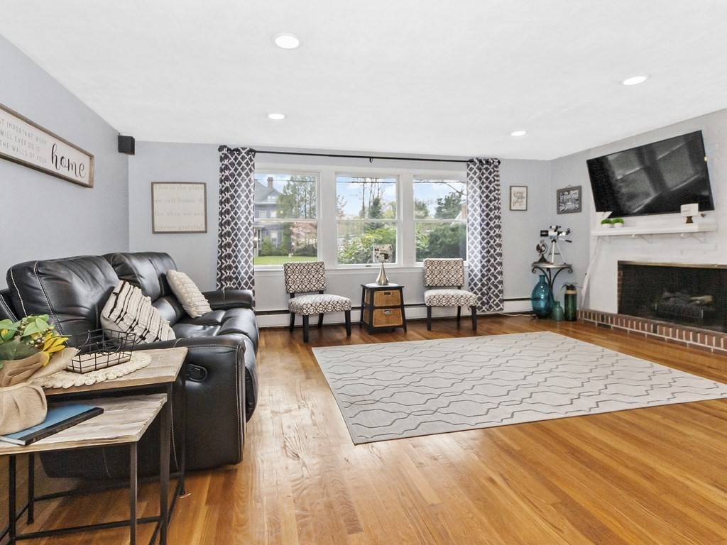 237 Linden Street Waltham, MA 02452 - Photo 9 of 33 a living room with furniture fireplace and flat screen tv