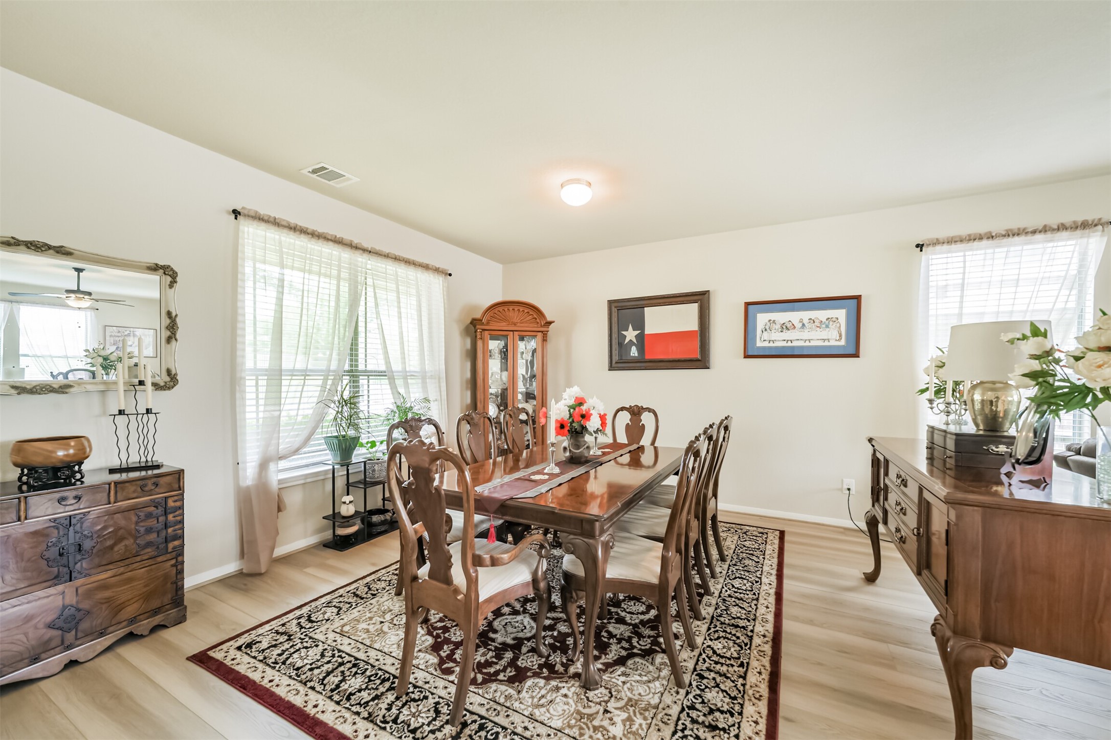12009 La Salle River Road Conroe, TX 77304 - Photo 8 of 50 a dining room with furniture and wooden floor