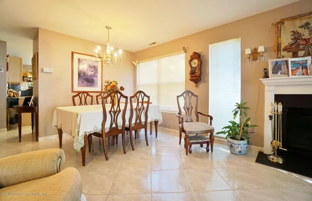 a view of a livingroom with furniture and a flat screen tv