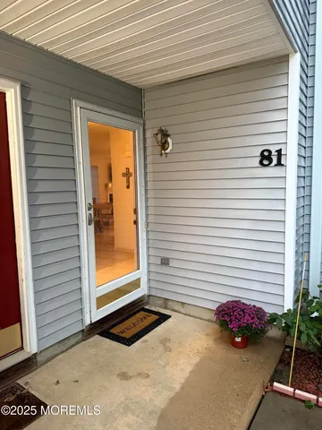 a view of a entryway door front of a house