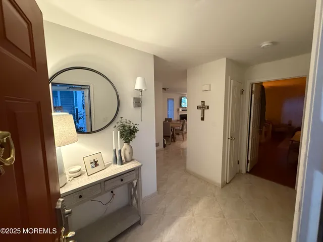 a view of living room with furniture and mirror