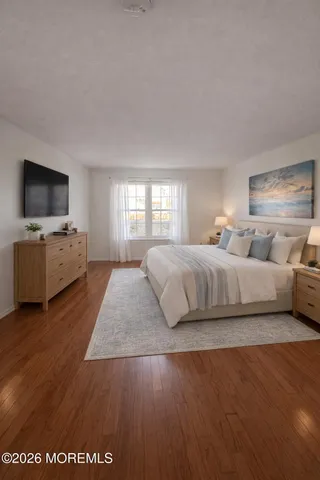 a bedroom with a bed and tv