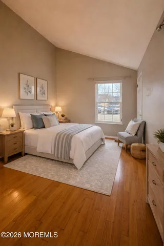 a bedroom with a bed and couch