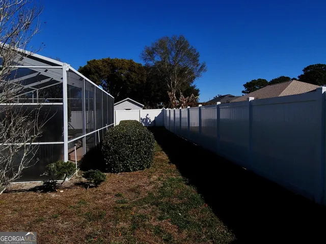 a dinning room with furniture and chandelier