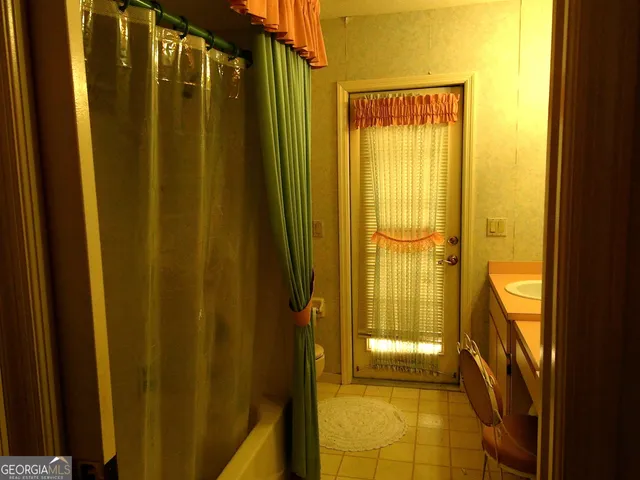 a room with a dresser and a mirror