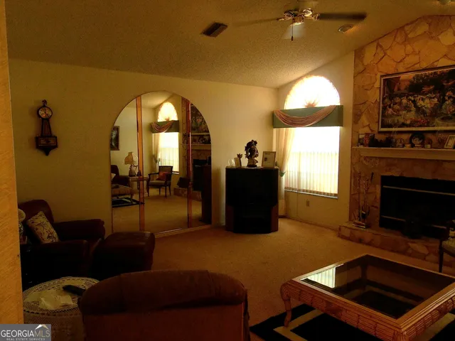 a bed room with a bed and a mirror