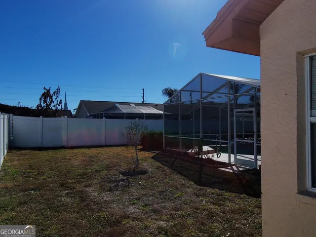 a view of deck with wooden floor and door