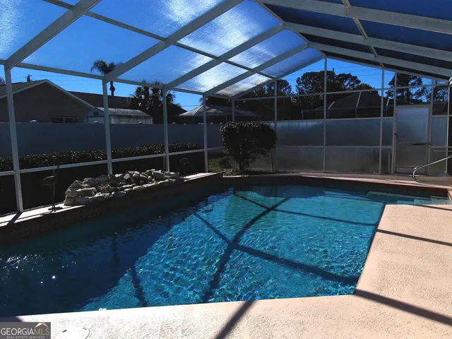 a balcony with table and chairs
