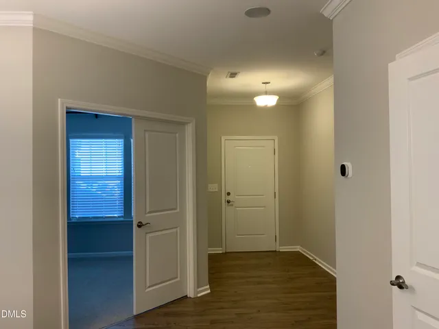 a kitchen with a refrigerator and a sink