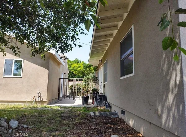 a house that has a tree in front of it