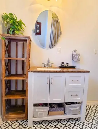 a bathroom with a sink and a mirror