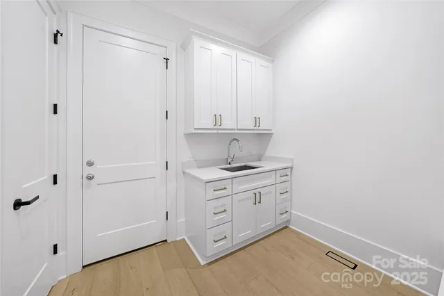 a room with a stove and a refrigerator