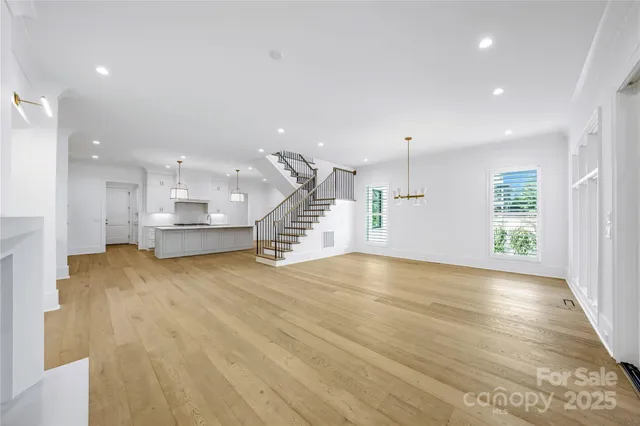 a view of a kitchen with a stove and kitchen view