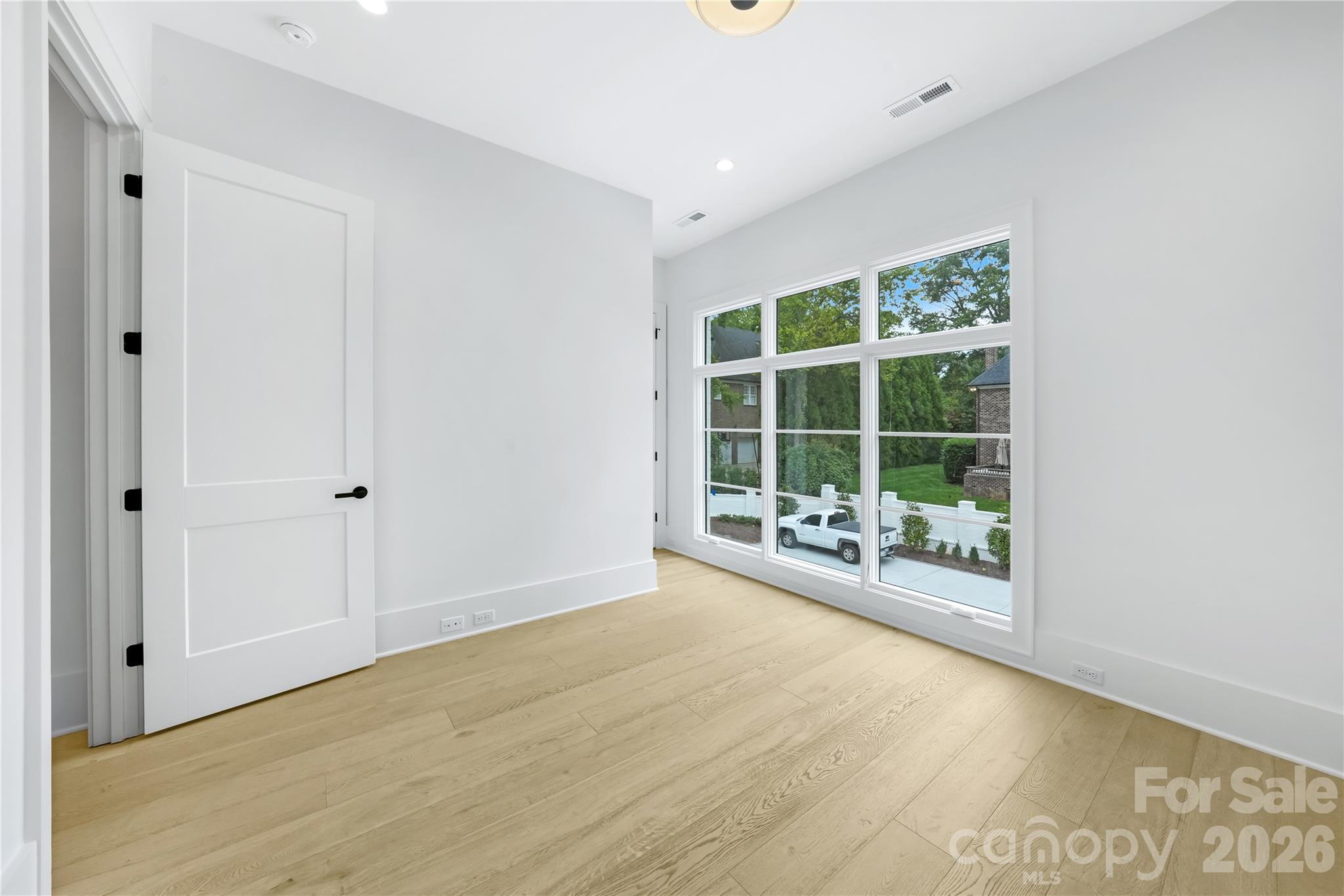 5031 Gilchrist Road, Unit 1A Charlotte, NC 28211 - Photo 44 of 46 a view of an empty room with a window