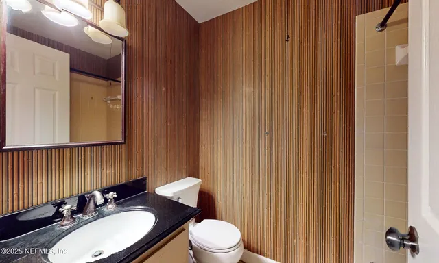 a view of storage and utility room with closet