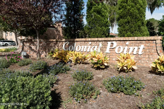 a front view of a house with a yard and outdoor seating