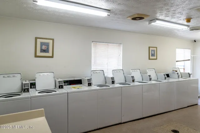an aerial view of a house with a lake view