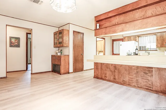 a bathroom with a granite countertop sink mirror and vanity