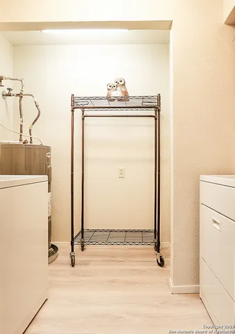 a view of a storage & utility room with a sink