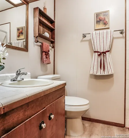 a bathroom with a toilet and a sink