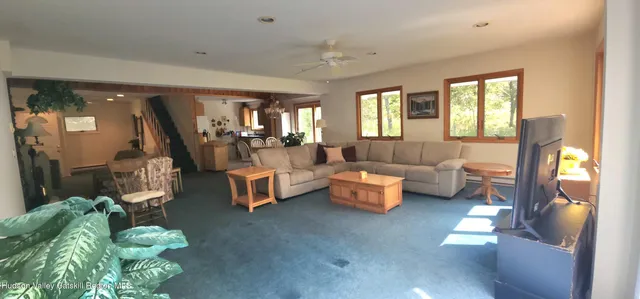 a spacious bedroom with a large bed and a window