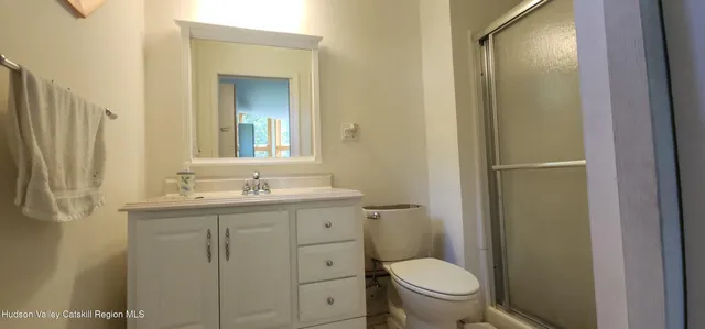 a view of a house with a yard and porch