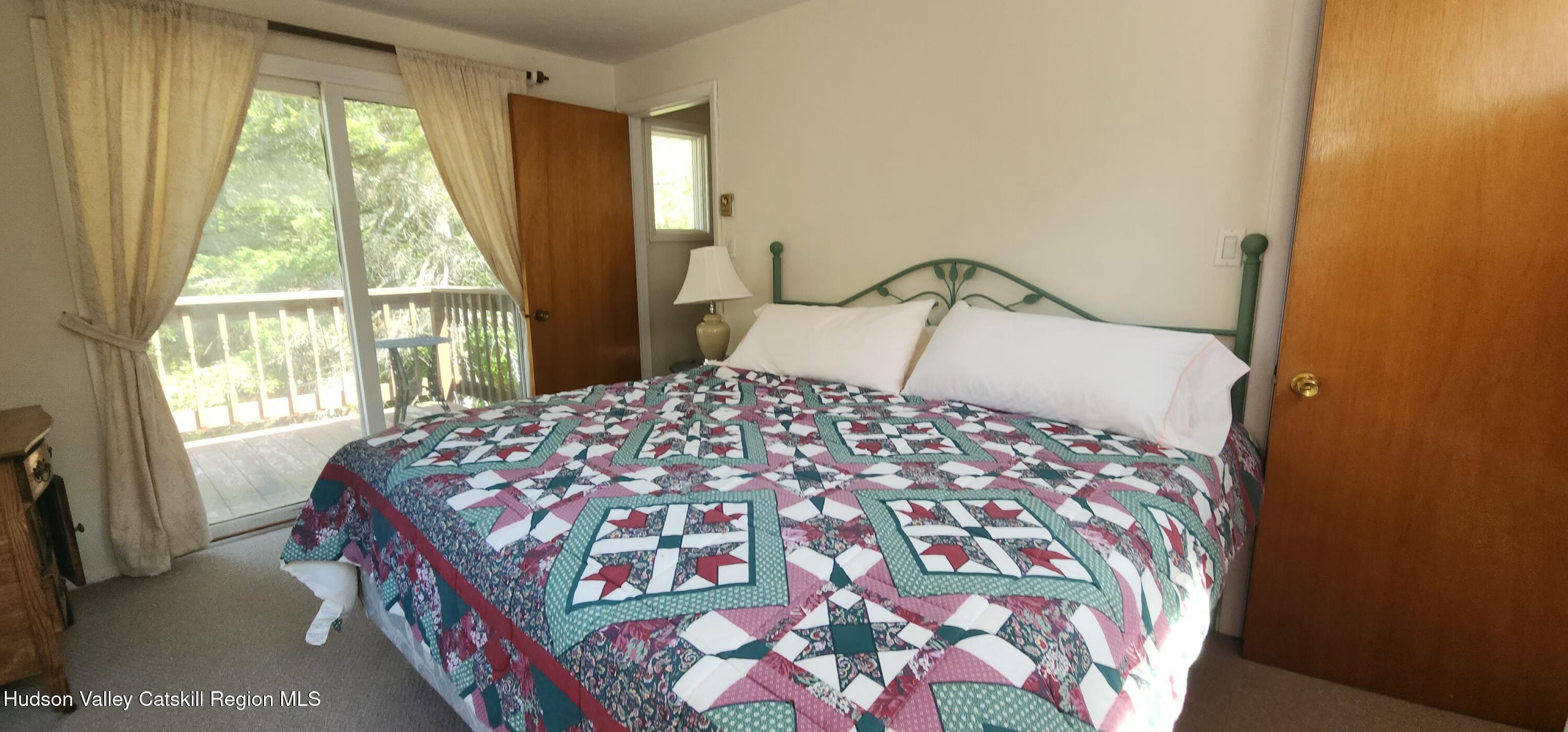 436 Big Hollow Road Maplecrest, NY 12454 - Photo 19 of 31 a bedroom with a bed and a window