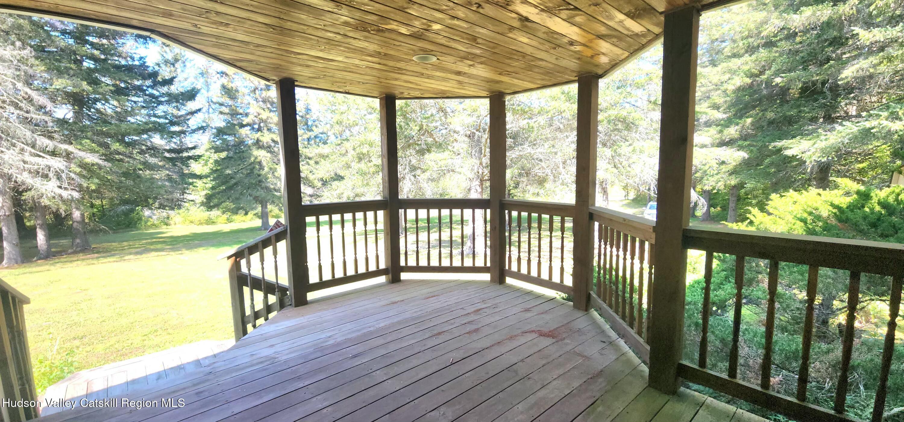 436 Big Hollow Road Maplecrest, NY 12454 - Photo 21 of 31 a view of a room with wooden floor and iron stairs