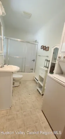 a kitchen with stainless steel appliances granite countertop sink stove and refrigerator