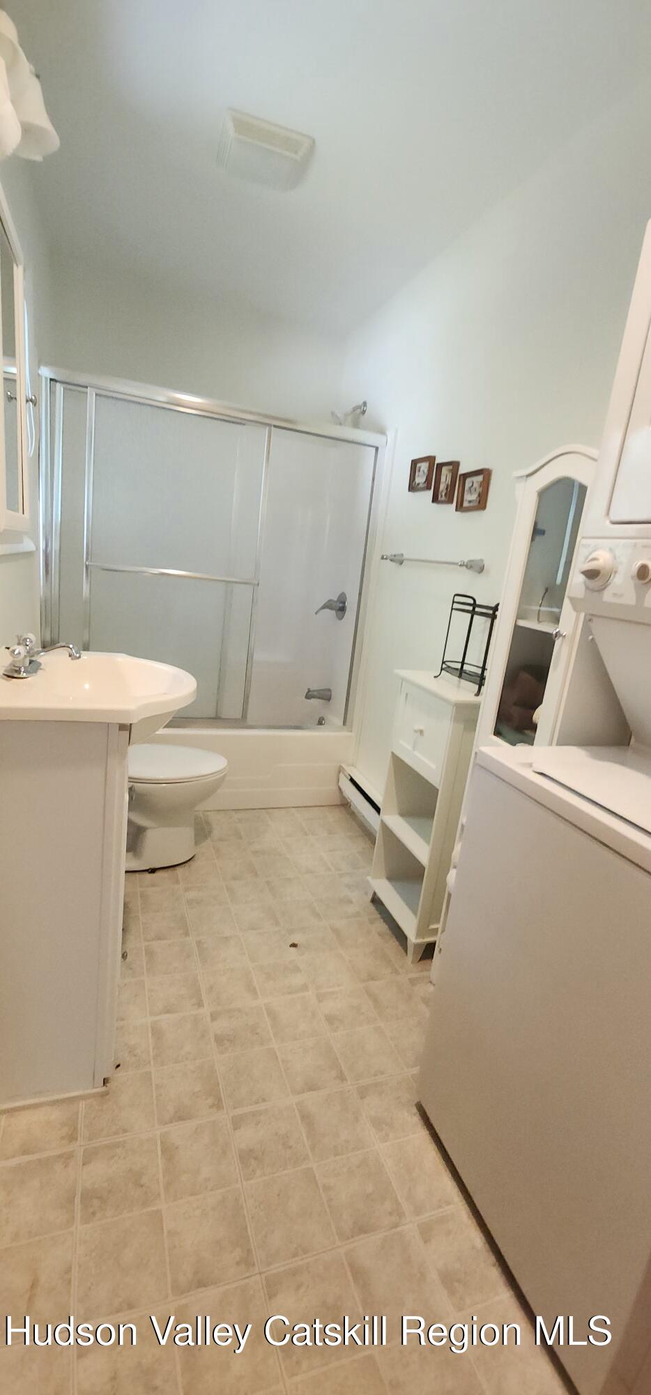 436 Big Hollow Road Maplecrest, NY 12454 - Photo 9 of 31 a bathroom with a sink toilet and vanity