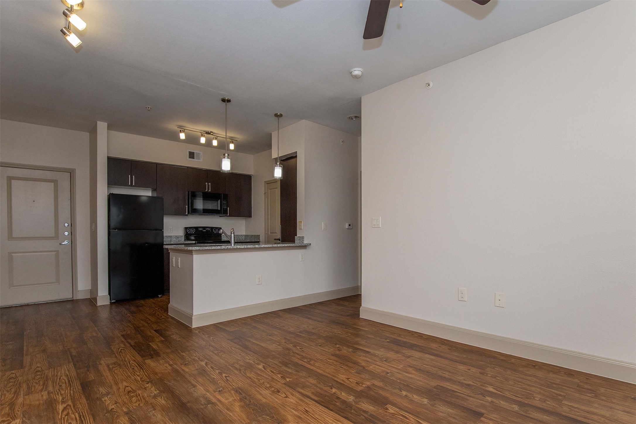 2930 Plum Creek Lane, Unit 2102 Houston, TX 77087 - Photo 3 of 19 a large kitchen with hardwood floor and a sink