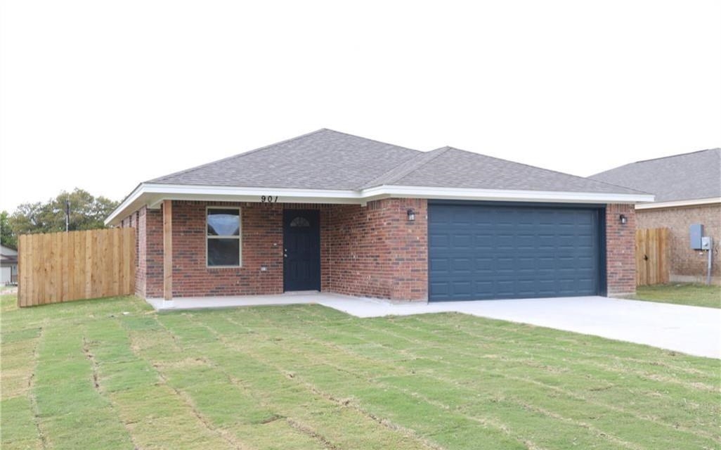 901 Blane Circle Lampasas, TX 76550 - Photo 1 of 1 a front view of house with yard and garage