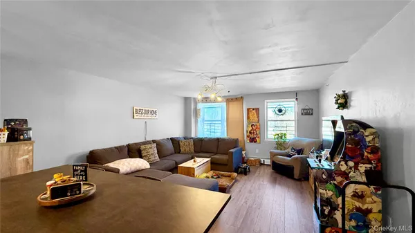 a living room with furniture a wooden floor and a couch