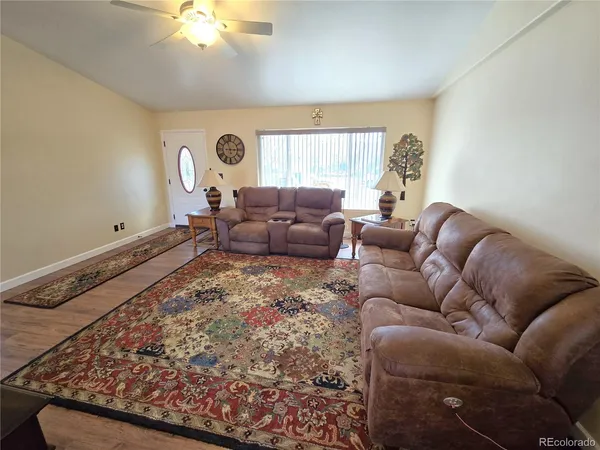 a living room with furniture and a rug