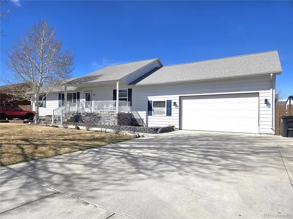 a view of a house patio and a yard