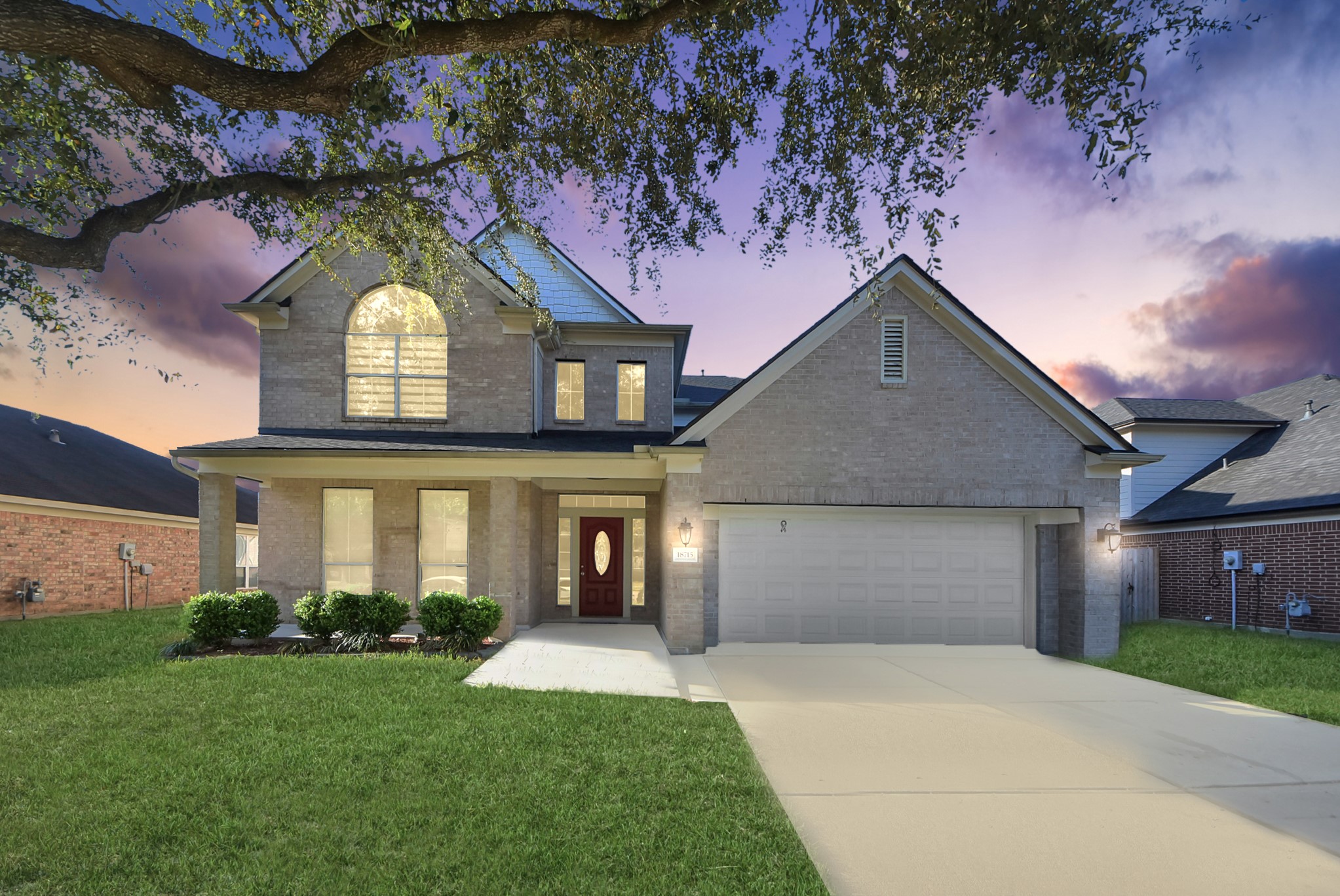 18715 Keystone Oak Street Houston, TX 77084 - Photo 1 of 50 a front view of a house with a garden and yard