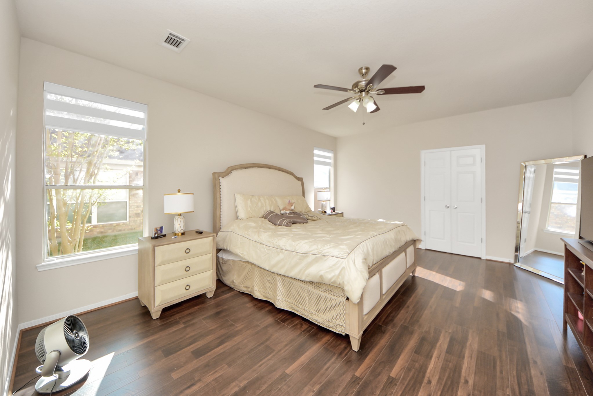 18715 Keystone Oak Street Houston, TX 77084 - Photo 20 of 50 a bedroom with a bed and wooden floor