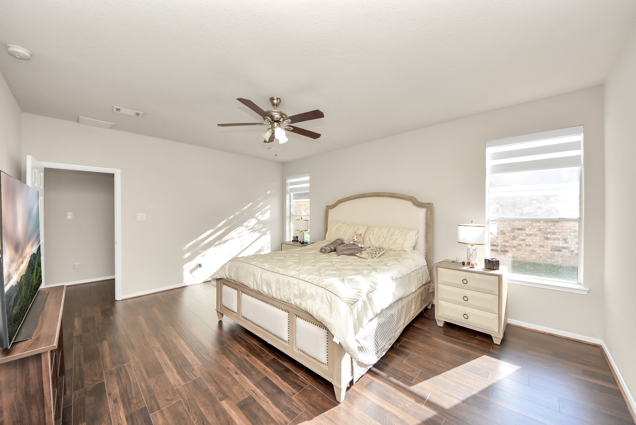 18715 Keystone Oak Street Houston, TX 77084 - Photo 21 of 50 a bedroom with a bed and a large window