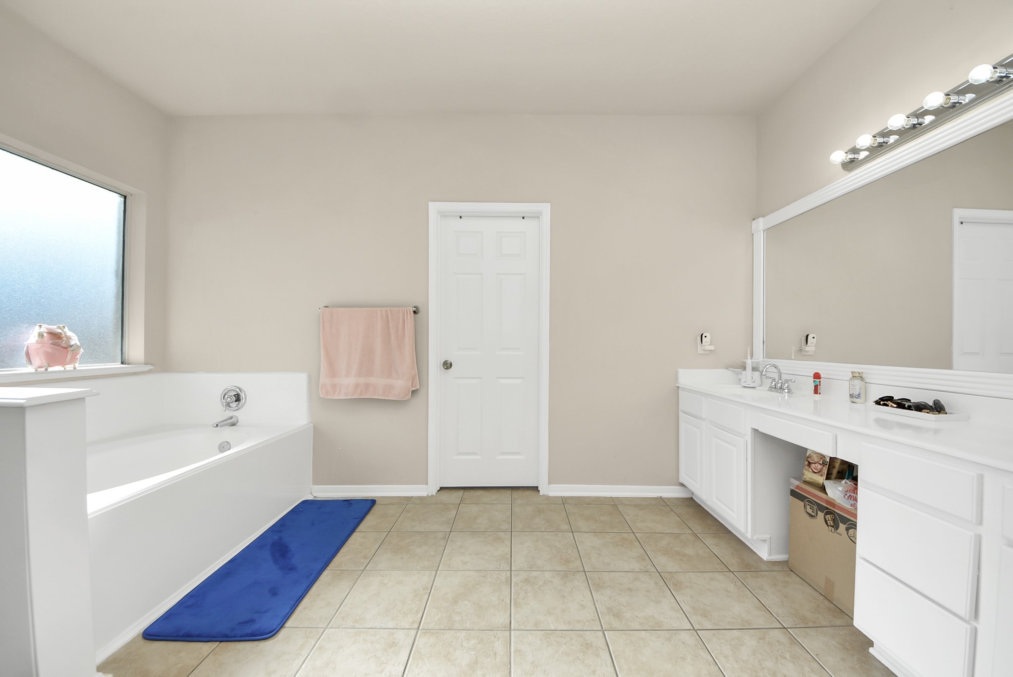18715 Keystone Oak Street Houston, TX 77084 - Photo 25 of 50 a spacious bathroom with a tub sink and mirror