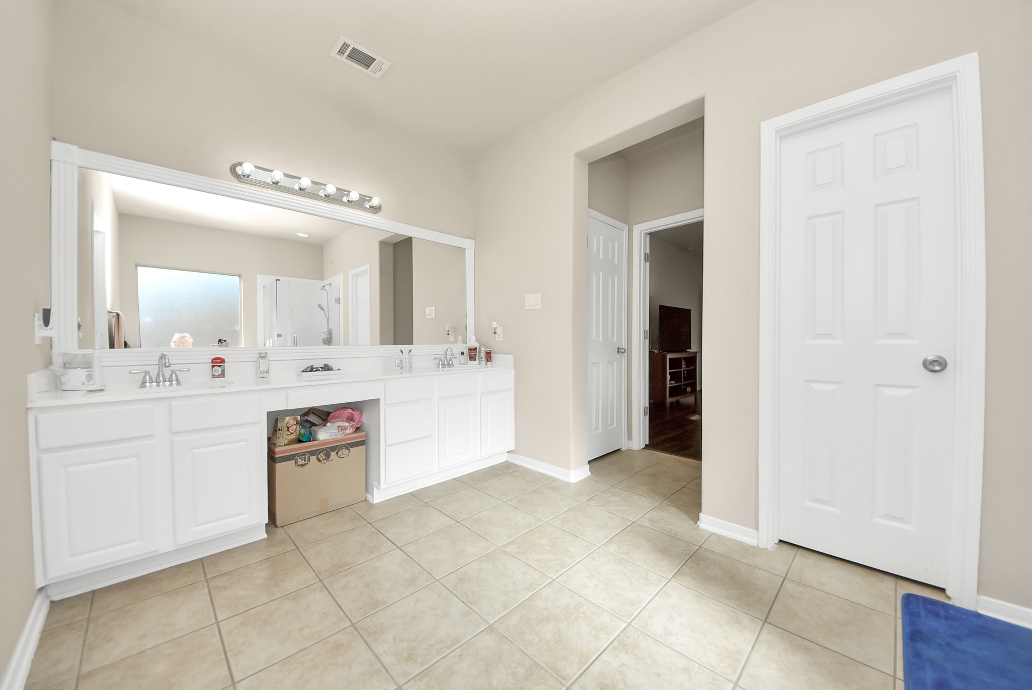 18715 Keystone Oak Street Houston, TX 77084 - Photo 27 of 50 a bathroom with a sink a vanity and a mirror