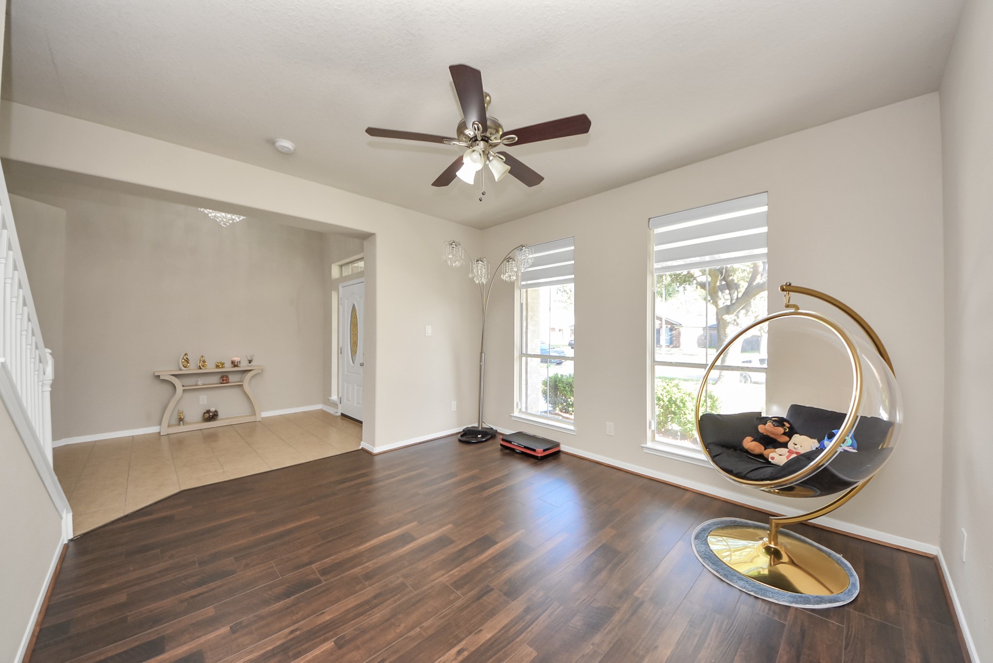 18715 Keystone Oak Street Houston, TX 77084 - Photo 3 of 50 a dining room with wooden floor and a floor to ceiling window