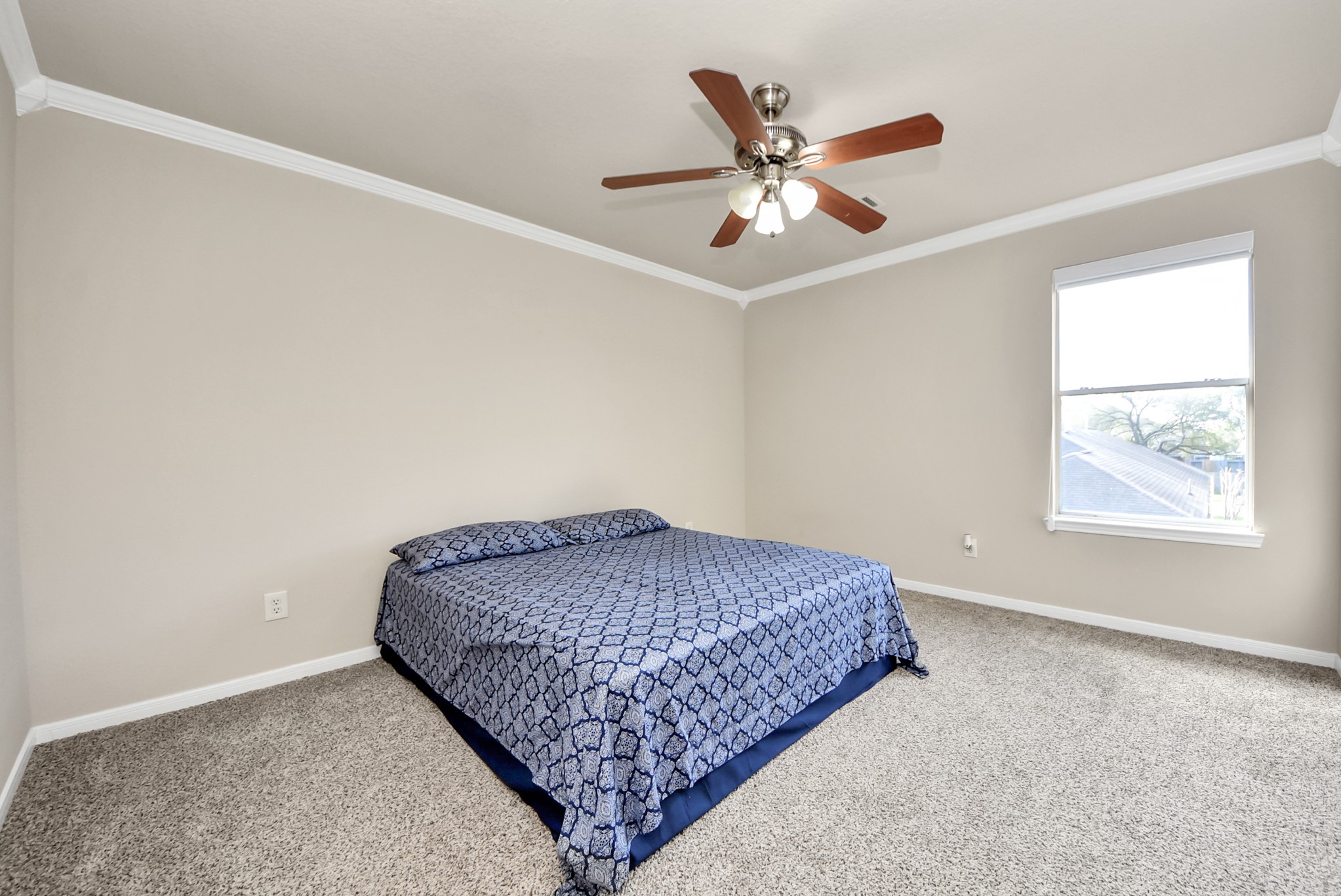 18715 Keystone Oak Street Houston, TX 77084 - Photo 36 of 50 a bedroom with a bed and window