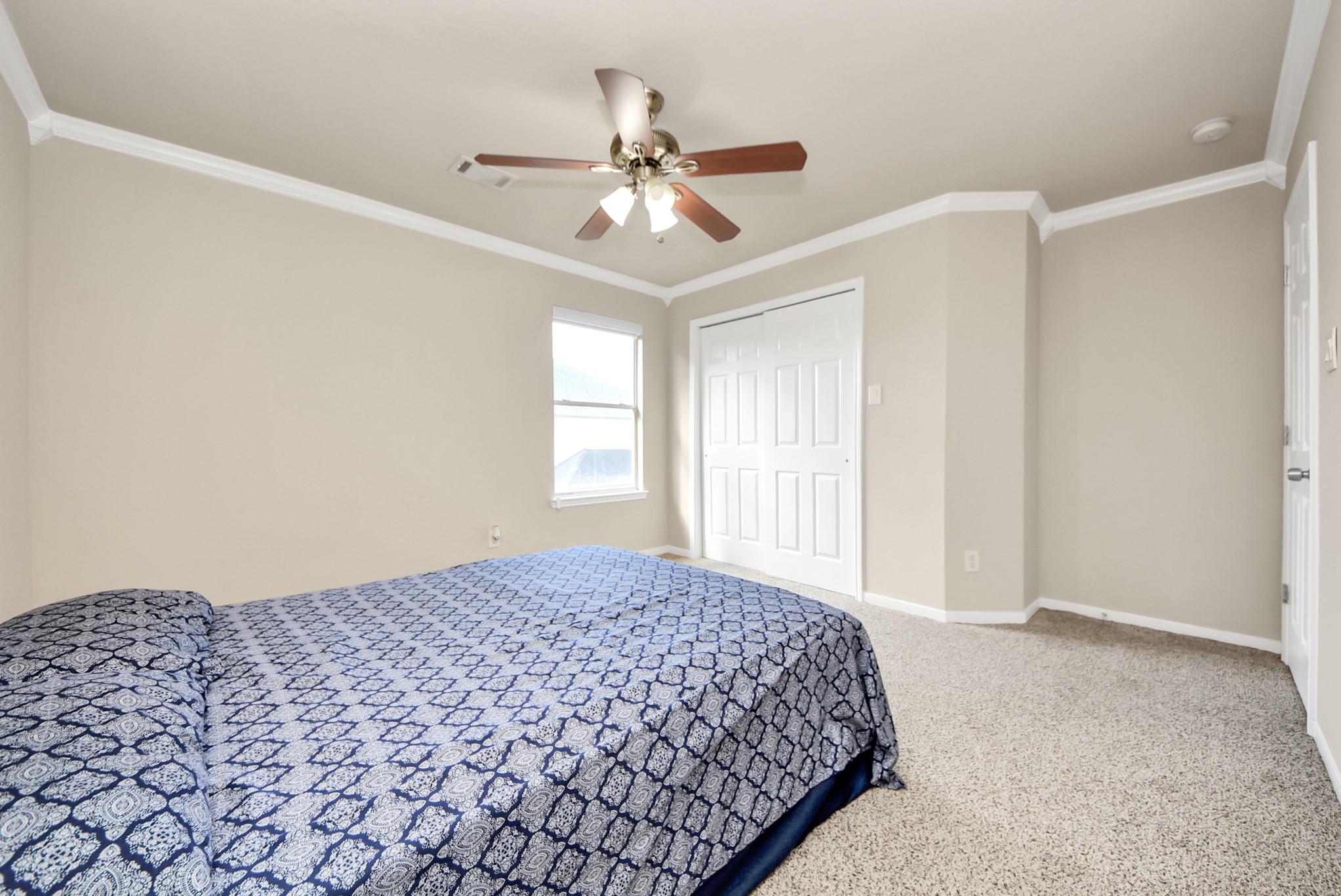 18715 Keystone Oak Street Houston, TX 77084 - Photo 38 of 50 a bedroom with a bed and a window