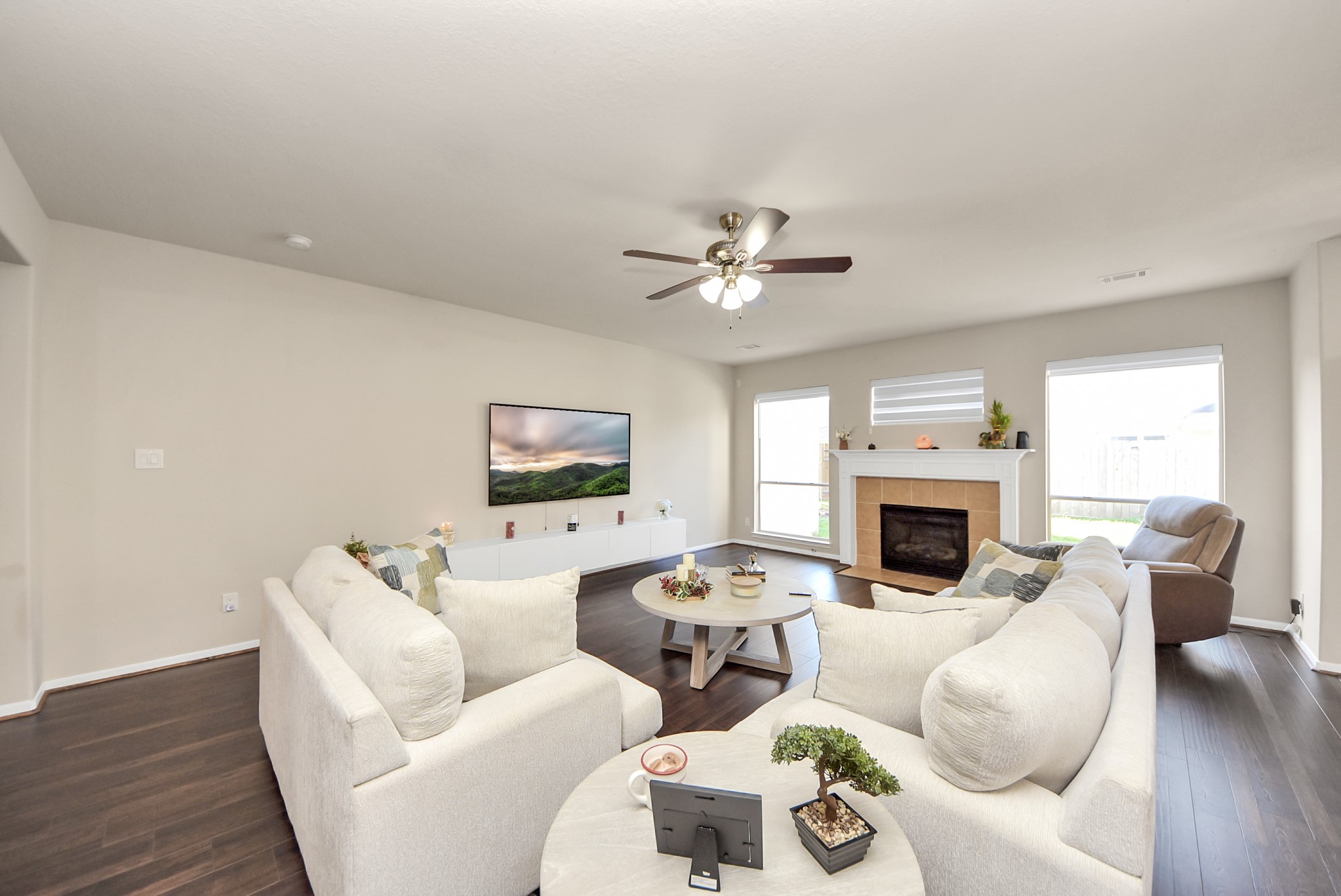 18715 Keystone Oak Street Houston, TX 77084 - Photo 7 of 50 a living room with furniture a fireplace and a flat screen tv