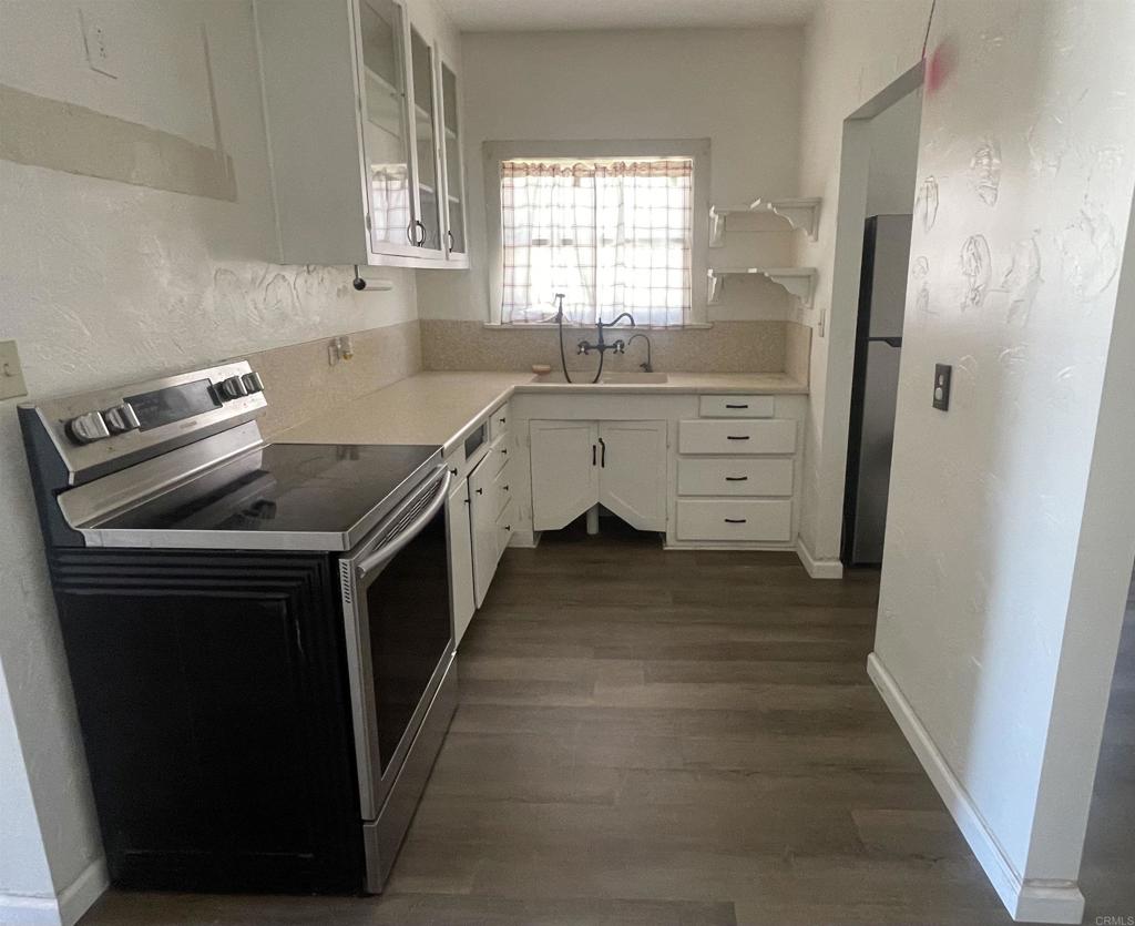 1115 South 6th Street El Centro, CA 92243 - Photo 7 of 19 a kitchen with a sink stove and refrigerator
