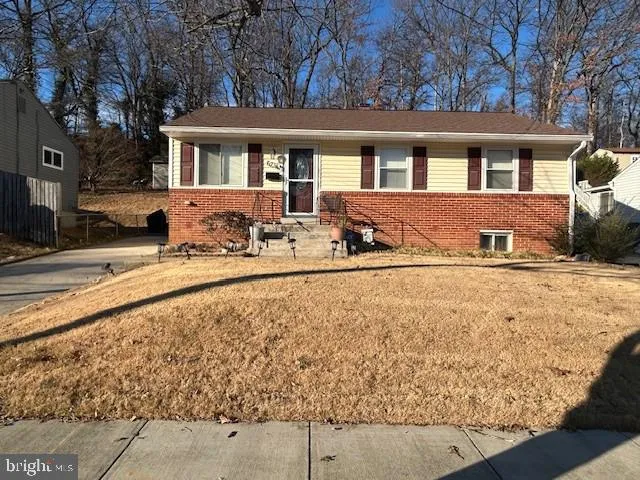 a view of a house with snow on the road