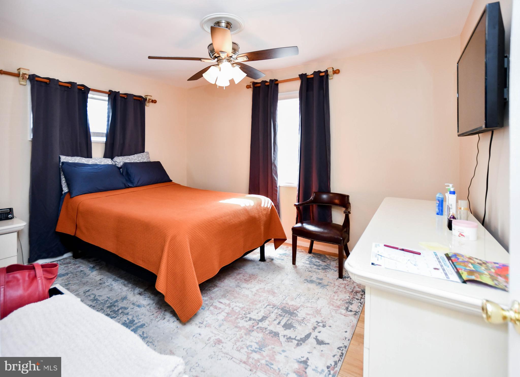 6714 Darby Road Hyattsville, MD 20784 - Photo 15 of 35 a bedroom with a bed and a chandelier
